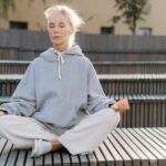 woman meditating sunrise