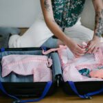 woman packing suitcase