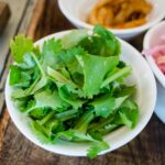 fresh cilantro leaves and coriander seeds